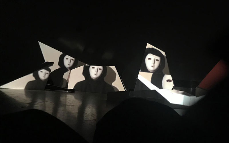 Image of the antagonist are projected on de set elements